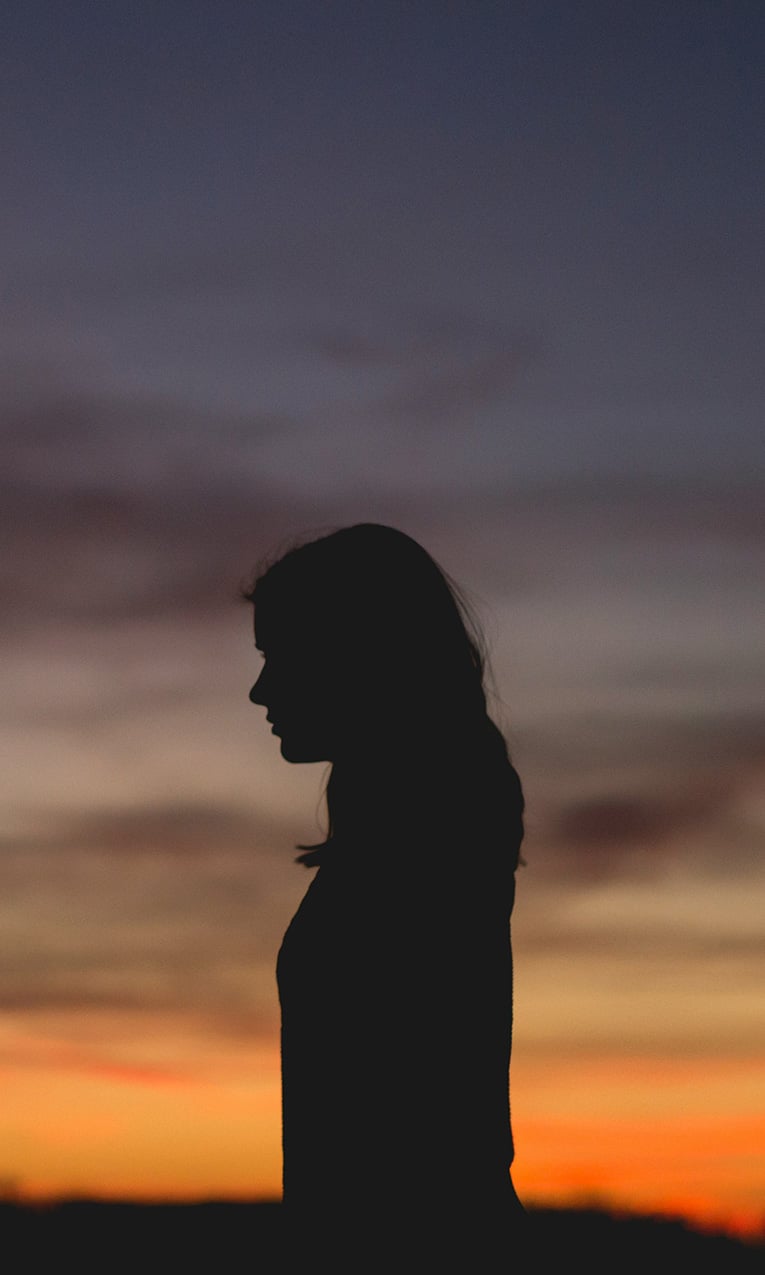 silhouette of a woman during sunset