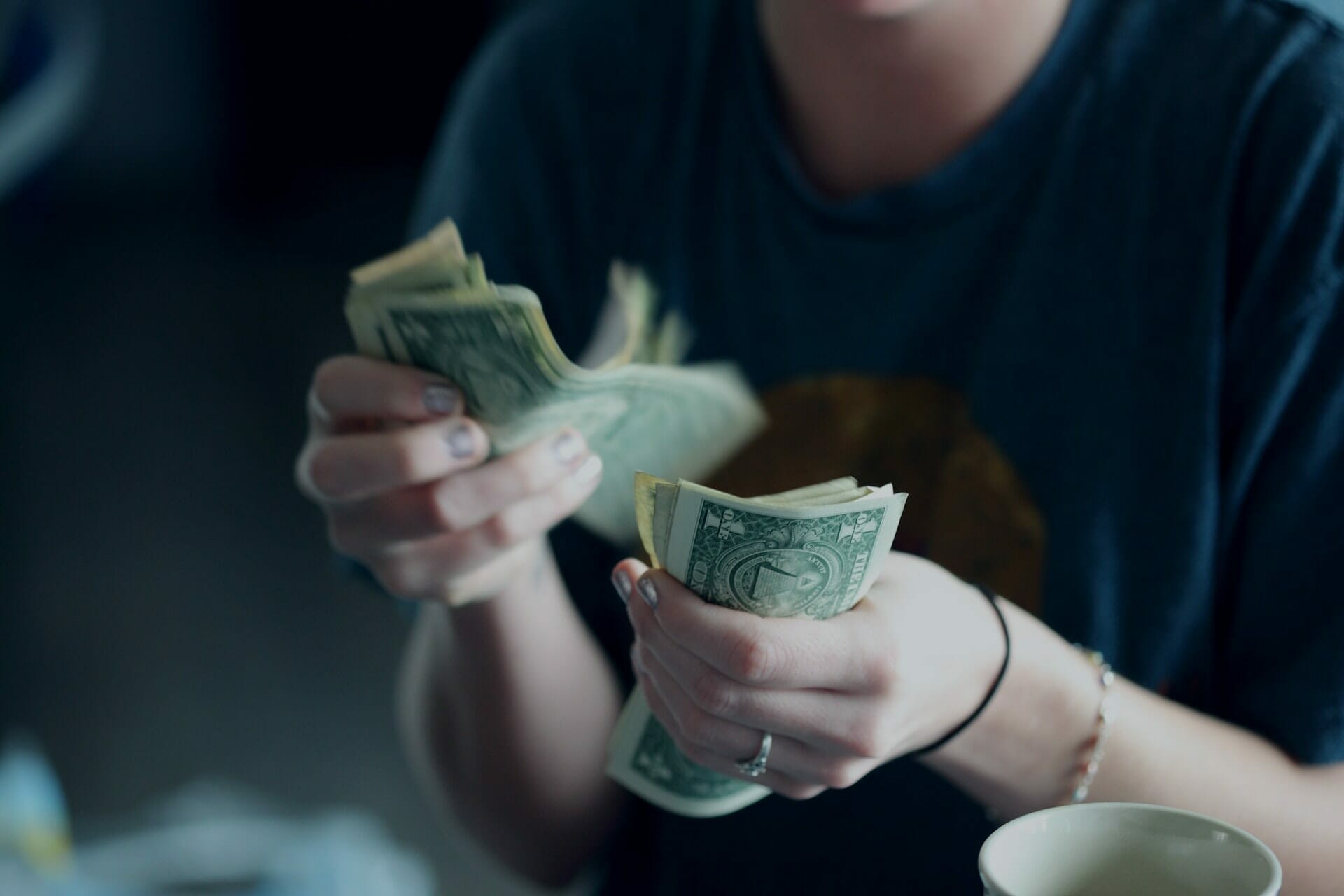 In this article, David Platt explores the question, "What Does the Bible Say About Giving?" The image for this picture of a man counting money.